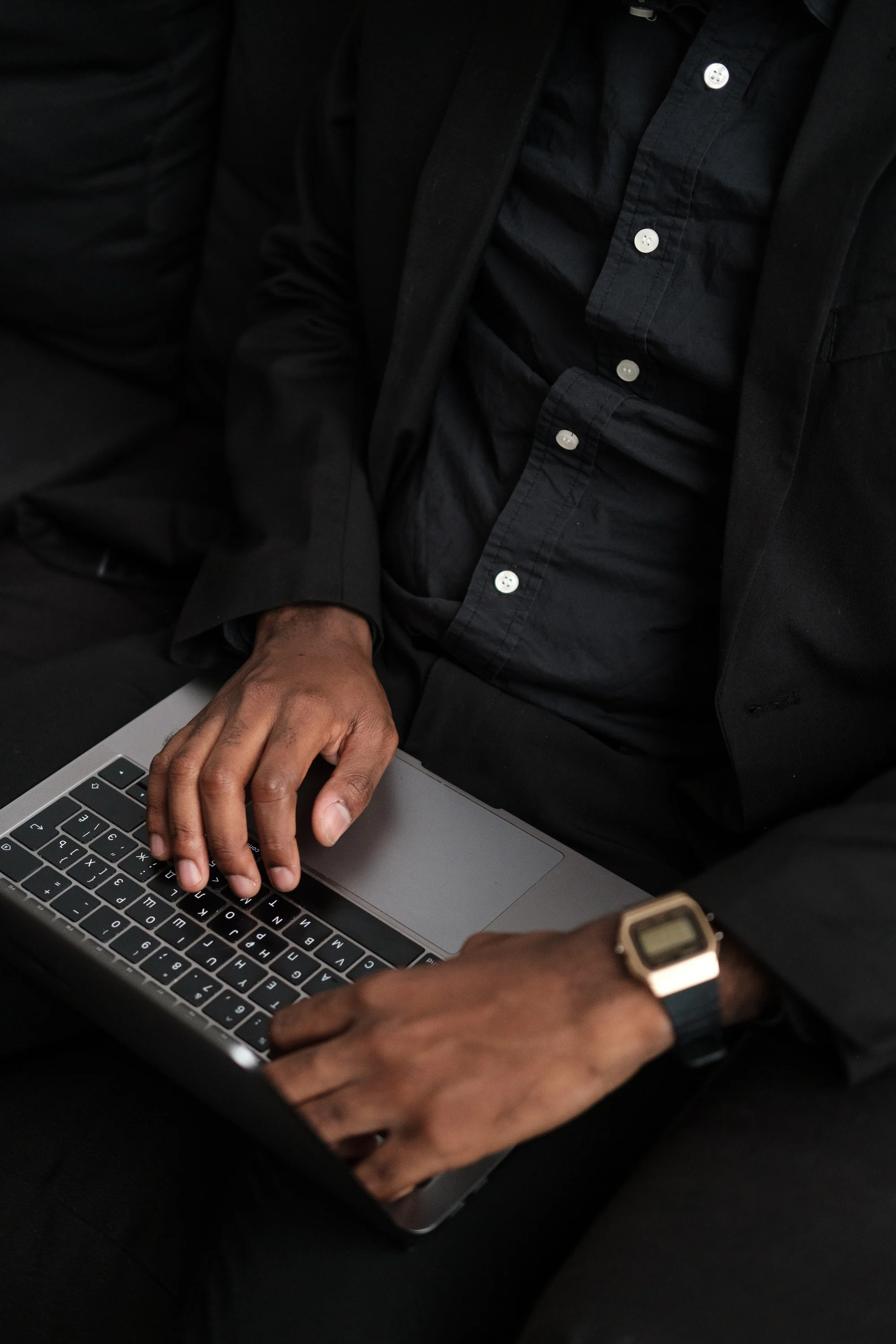 Man Typing on Laptop